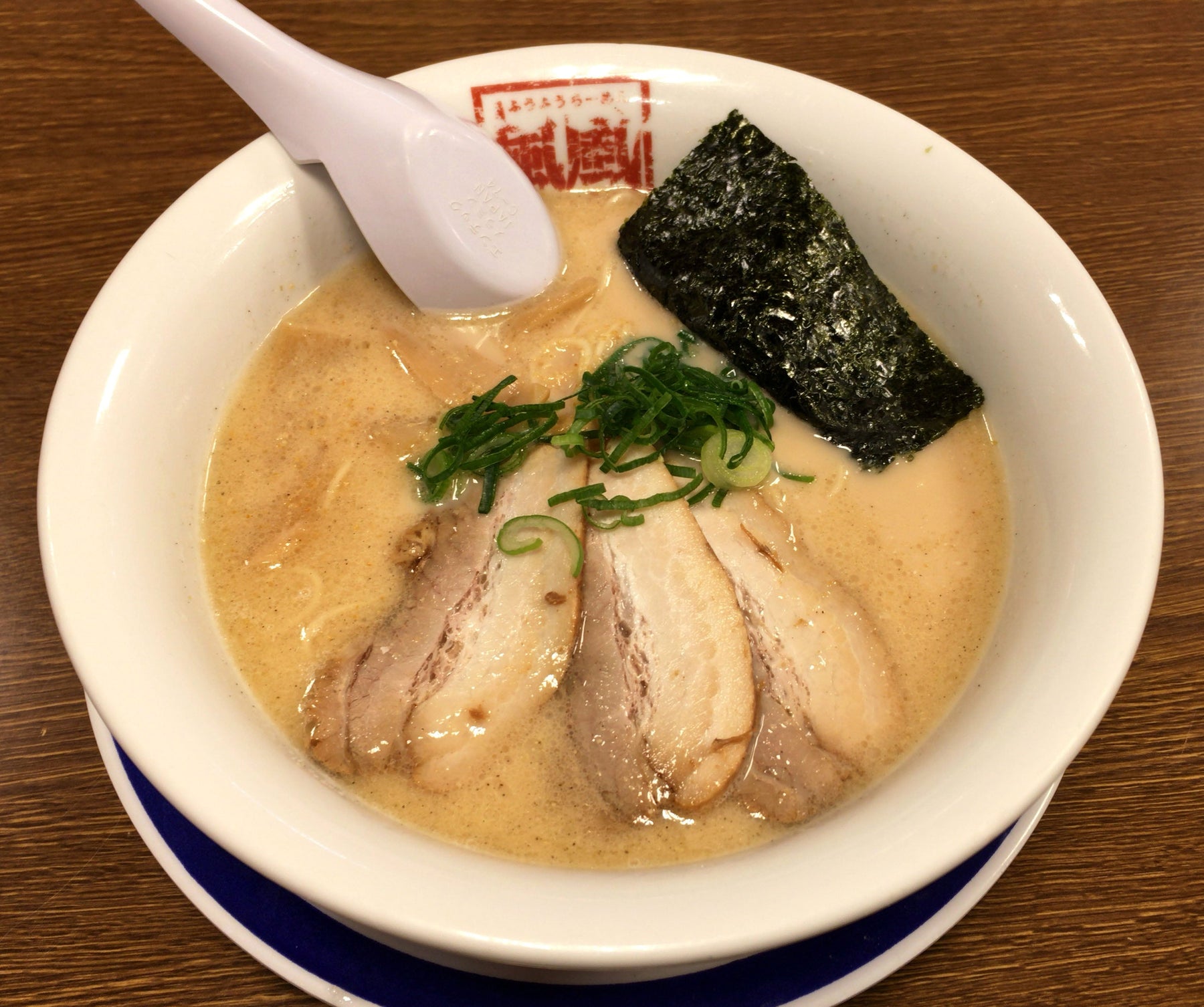 Bowl of Hakata-style tonkotsu ramen with pale pork bone broth, chashu and spring onion